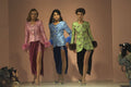 712030 Three Women In Pink, Blue And Green Patterned Jackets A4 Photo Print