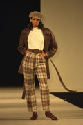 712034 Woman Wearing Brown Tartan Trousers, Leather Coat And Cap A4 Photo Print