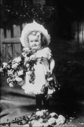 713037 Studio Portrait Of A Child With Flowers A4 Photo Print