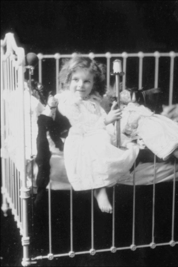 713059 Child In Crib A4 Photo Print