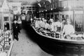 713080 Men Behind Counter A4 Photo Print