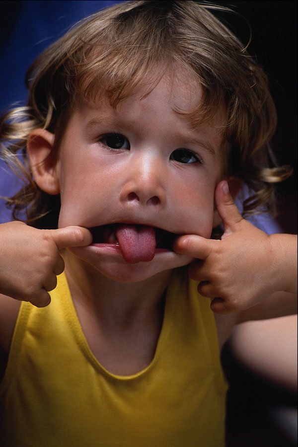 716057 Little Girl Making A Funny Face A4 Photo Print