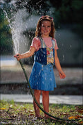 716062 Child With Garden Hose A4 Photo Print