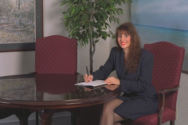 719004 A Professional Woman Sitting At Round Table With Notepad A4 Photo Print