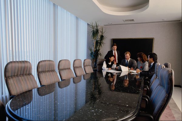 719046 Executives In Conference Room A4 Photo Print