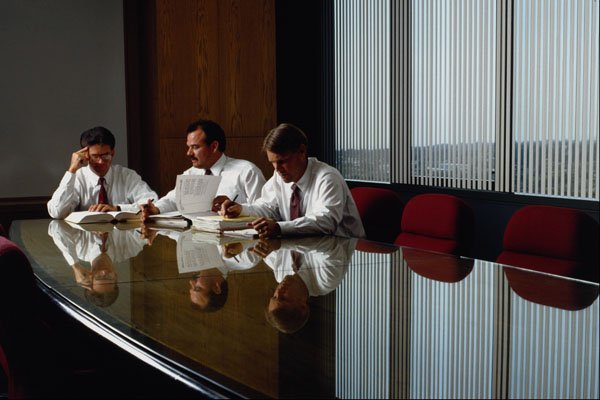719085 Corporate Executives At Conference Table A4 Photo Print