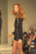 725058 Female In Black Pleated Top And Satin Look Miniskirt A4 Photo Print