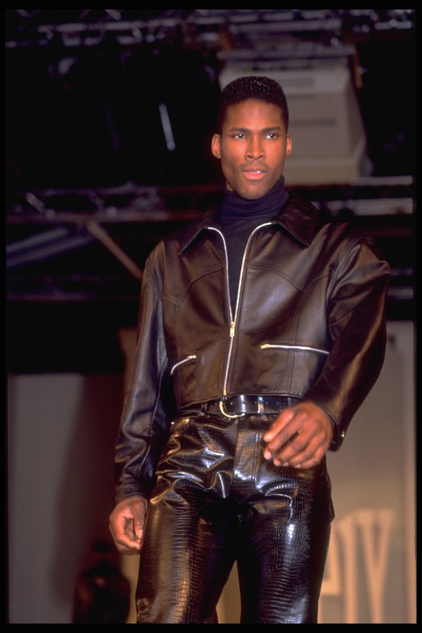725066 Male In Brown Leather Jacket And Snakeskin effect Trousers A4 Photo Print