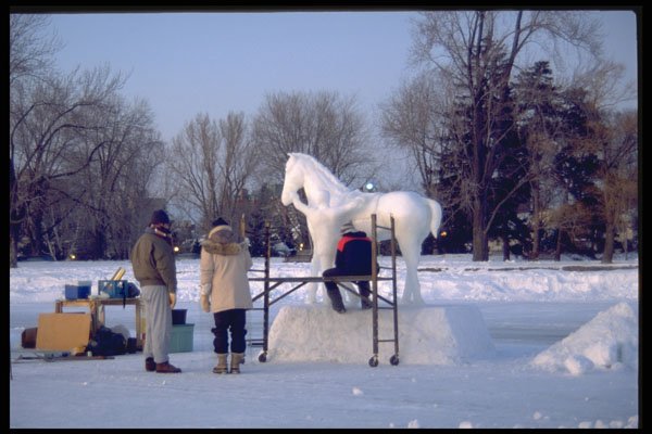 728021 Working On A Snow Sculpture A4 Photo Print