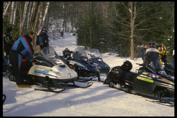 728075 Snowmobilers Gather To Converse A4 Photo Print