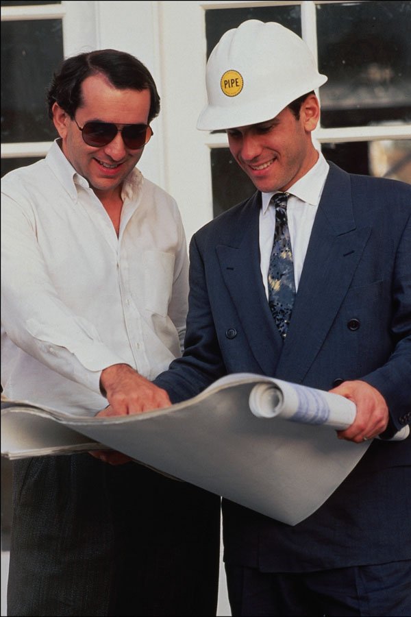 730088 Two Male Real Estate Developers Analyzing Blue Prints, California, U.S.A. A4 Photo Print