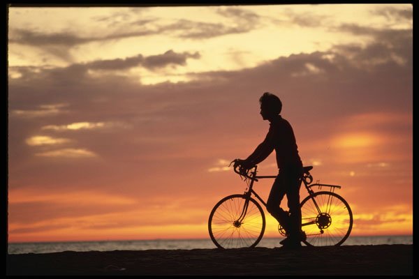 732048 Biker At Sunset A4 Photo Print