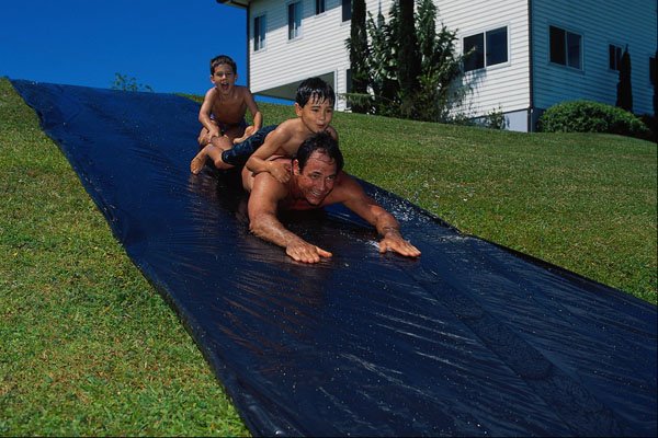 732079 Father And Son On Water Slide A4 Photo Print