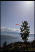 735001 Paraglider Flying Over Valley Lake A4 Photo Print