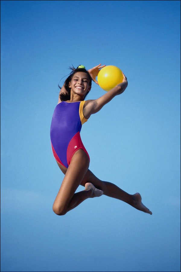 743009 Girl Jumping, With Ball A4 Photo Print