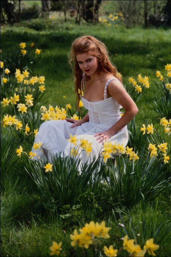 745029 Girl In White Sitting Among Daffodils A4 Photo Print