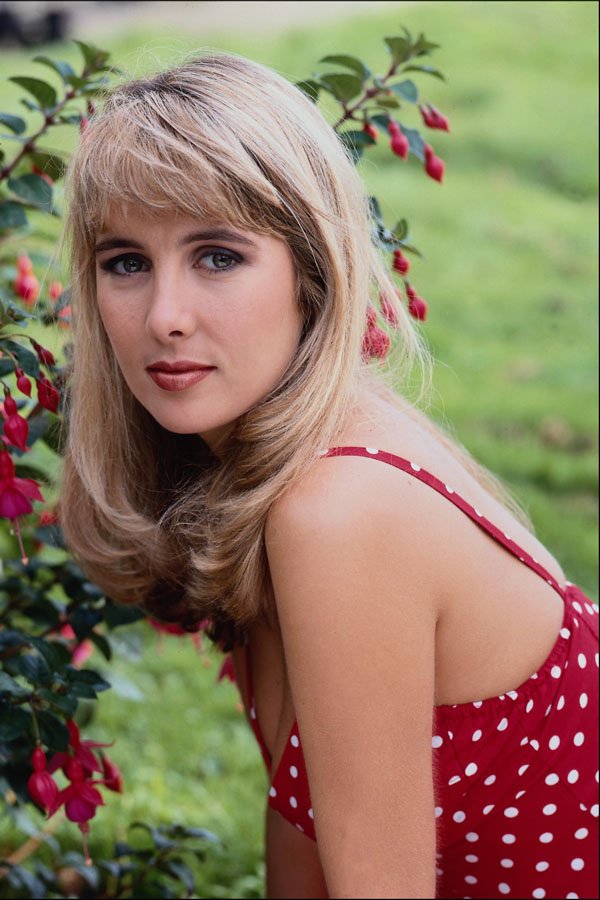 745037 Girl In Red Top Near Fuchsias A4 Photo Print