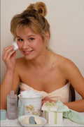 749003 Cathy, Blonde Applying Toner At Dressing Table A4 Photo Print