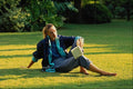 749044 Blonde Girl Reading In The Garden A4 Photo Print