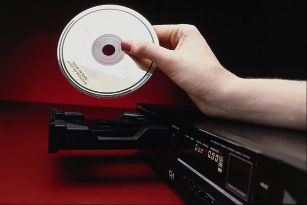 761086 Hand, CD And CD Player A4 Photo Print