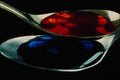 762095 Spoons With Blue And Red Liquid A4 Photo Print