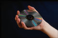 764071 Hand Holding A Compact Disk A4 Photo Print