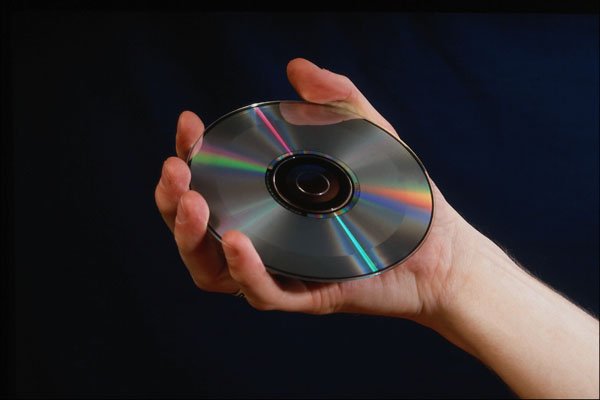 764071 Hand Holding A Compact Disk A4 Photo Print