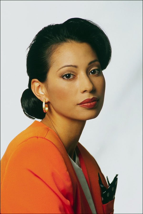 765024 Elegant Woman With Orange Jacket A4 Photo Print