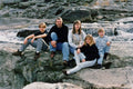 766020 Family Of Five On The Rocks A4 Photo Print