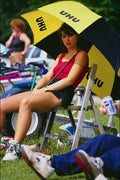 766028 Woman In Chair, With Umbrella A4 Photo Print
