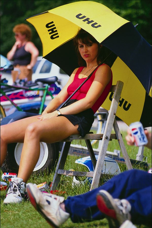766028 Woman In Chair, With Umbrella A4 Photo Print