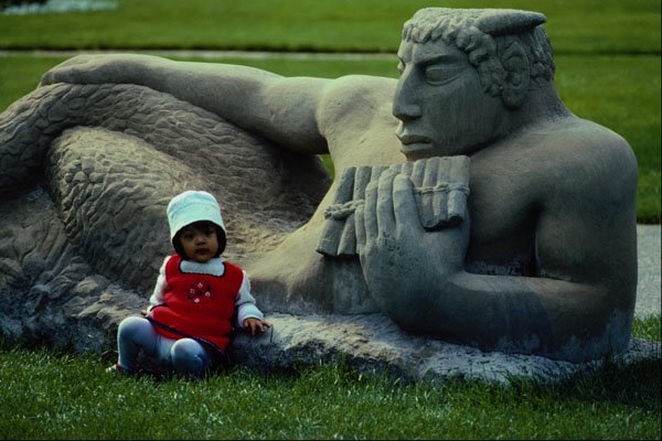767084 Child By Statue A4 Photo Print