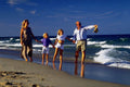 770050 Family Of Four, On Beach A4 Photo Print