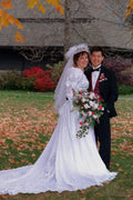 770085 Bride And Groom Standing In Fall Leaves A4 Photo Print