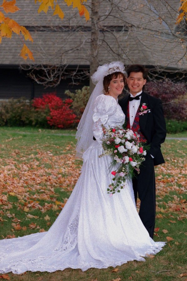 770085 Bride And Groom Standing In Fall Leaves A4 Photo Print