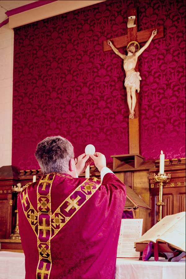 776077 Priest Elevating The Host At Altar During Mass A4 Photo Print