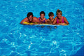 783002 Family On Mattress In Pool, Lanzarote, Spain A4 Photo Print