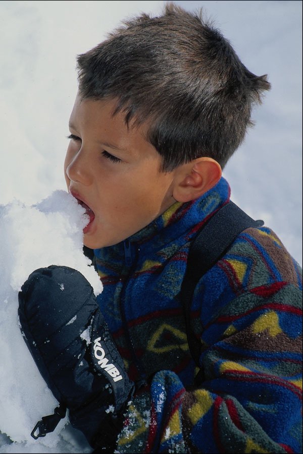 783009 Young Boy Eating Snow A4 Photo Print