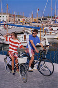 783028 Couple On Bikes, Puerto Pollensa, Mallorca, Spain A4 Photo Print