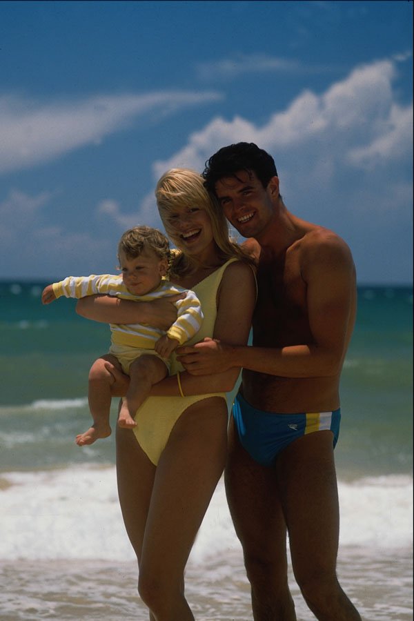 783038 Couple On Beach, With Baby A4 Photo Print