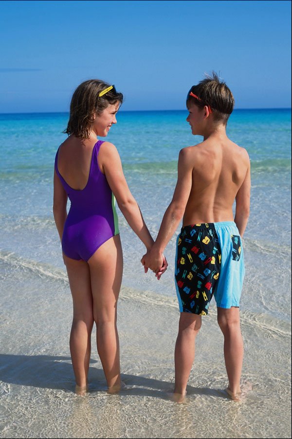 783090 Boy And Girl, In Sea A4 Photo Print