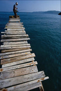 784030 Local Man, Pier At Ibiza, Spain A4 Photo Print