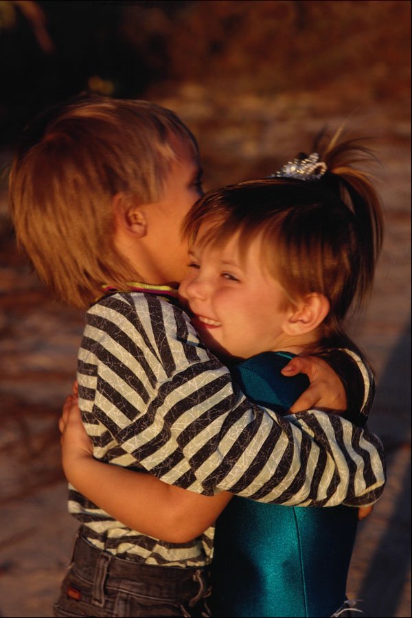 784051 Brother And Sister Hugging A4 Photo Print