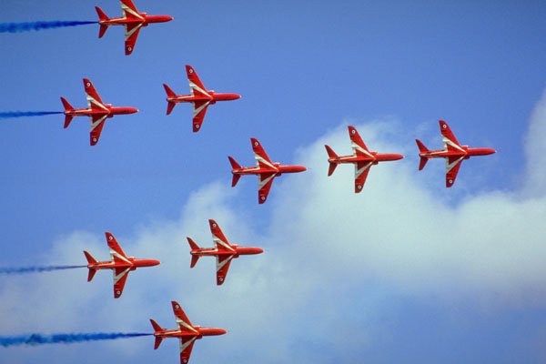 786096 Underside Of Red Arrows Flying In Close Formation, With Smoke A4 Photo Print