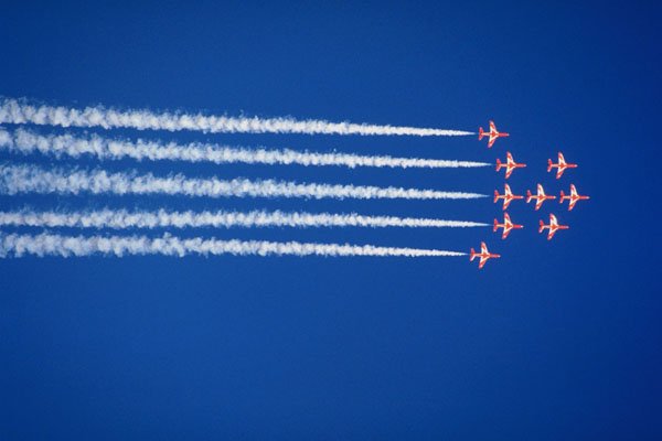 786097 Red Arrows Flying In Arrowhead Formation With Smoke Trails A4 Photo Print