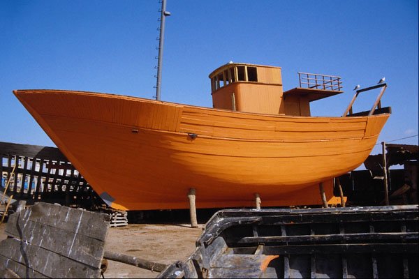 794006 Boat Building On The Coast A4 Photo Print