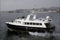 796057 Luxury Cabin Cruiser Leaving Torquay Harbor, Devon, England A4 Photo Print