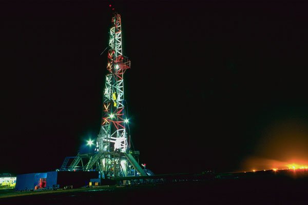 799025 Oil Drilling Rig At Night A4 Photo Print