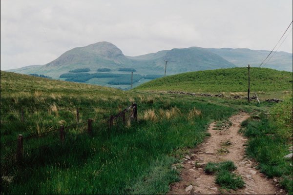 802092 Country Road With Hills In Background A4 Photo Print