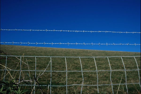 802094 Hill And Sky With Barbed Wire Fence A4 Photo Print